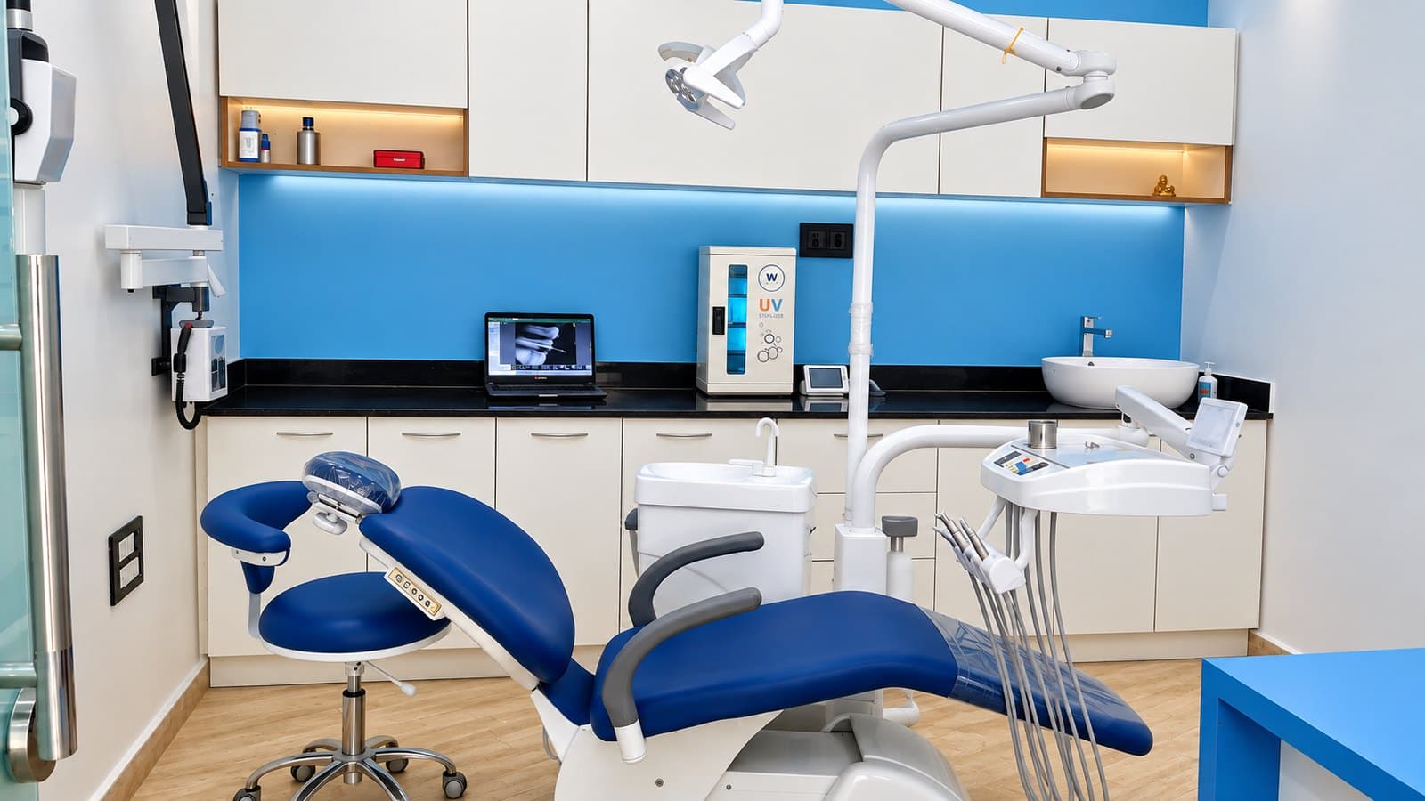 A treatment room at Family Dental, with the chair, steriliser and X-ray screen